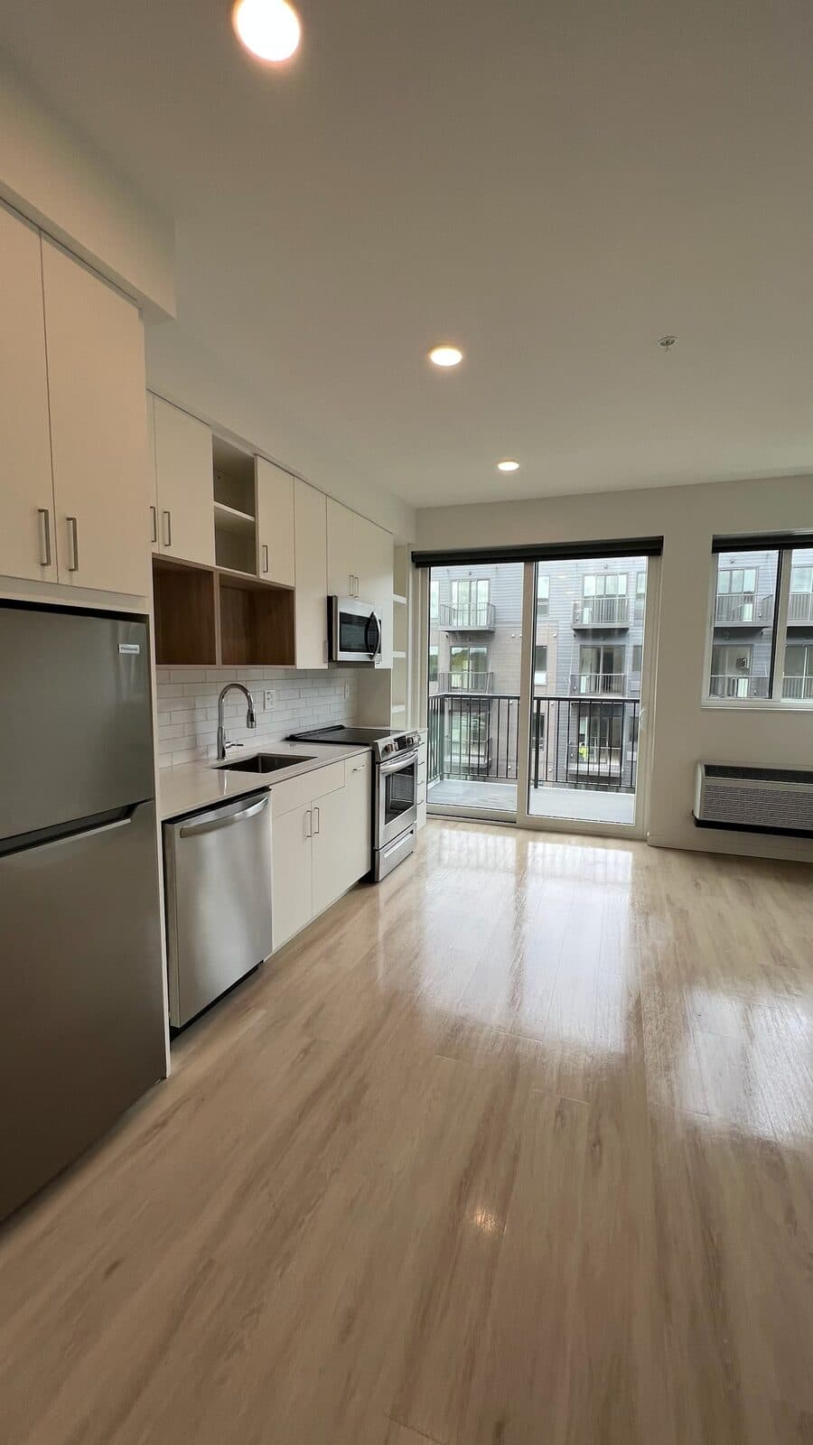 A bright, spotless open-concept kitchen and living area cleaned by Neat N Clean Co.